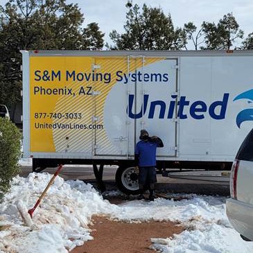 S&M Moving truck in the snow