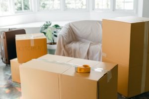 boxes in a living room area to demonstrate how to clean and organize before you move